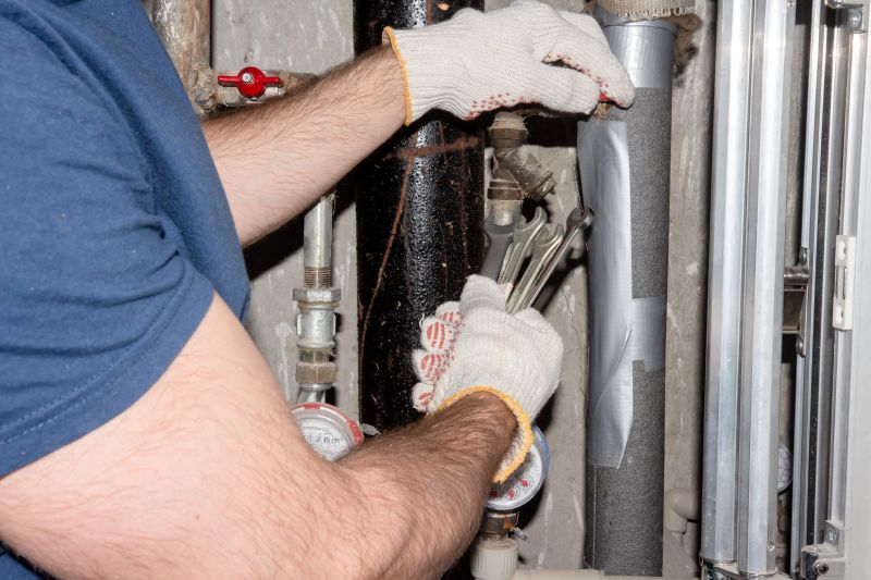 Plumber Repairing a Leak